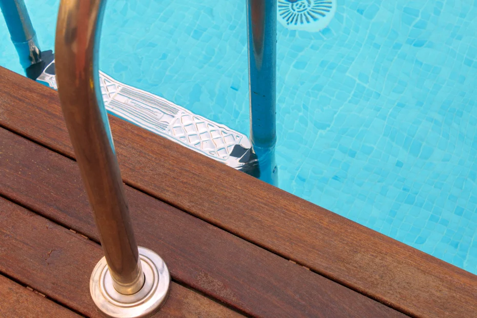 A photo of a pool ladder in a full pool